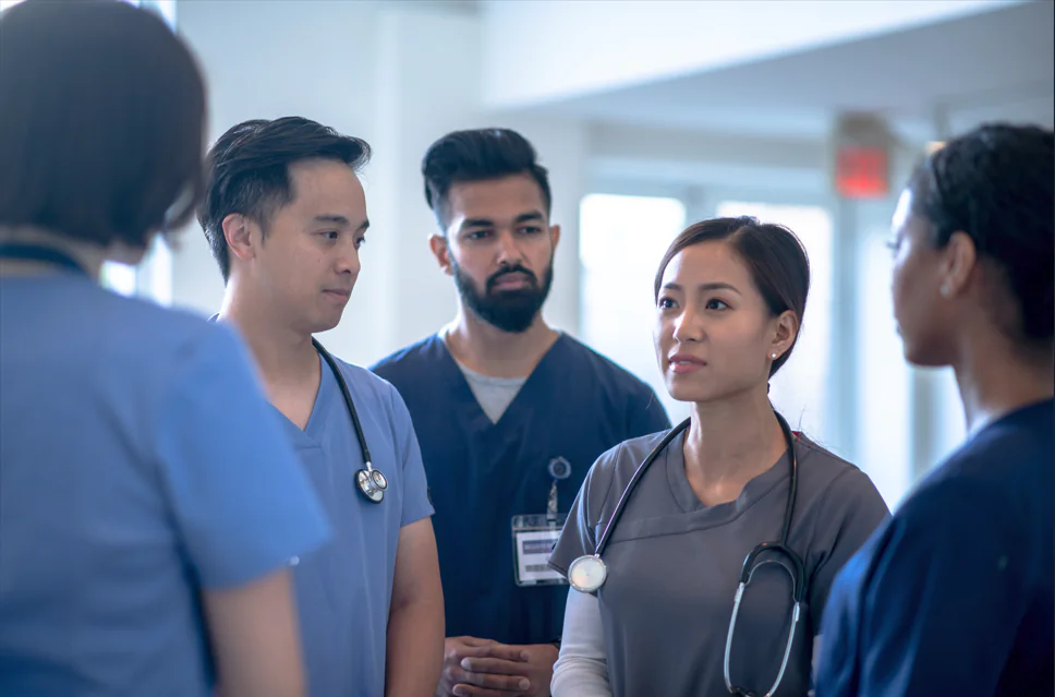 group of nurses together talking